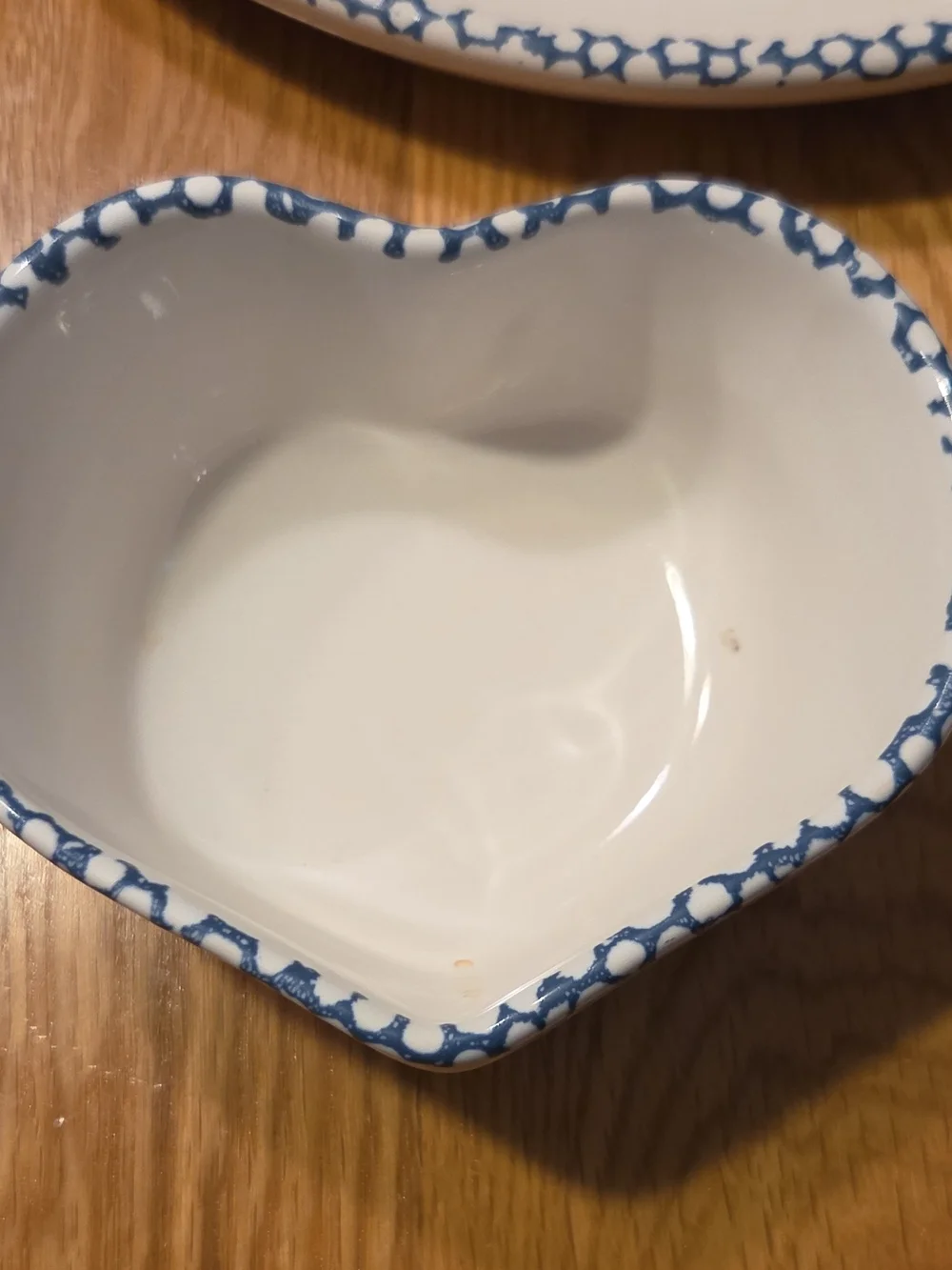 White Ceramic Heart Dip Bowl on Blue Floral Plate